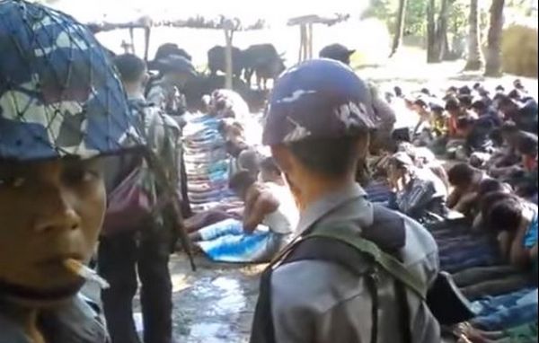 Capture écran d'une vidéo montrant un Rohingya se faire battre par des policiers.