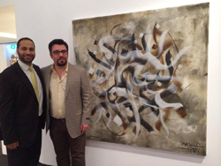 Moustafa Fahour (à gauche) avec Sabah Arbilli, le lauréat du Prix  intenational de galigraphie devant l'une de ses oeuvres.